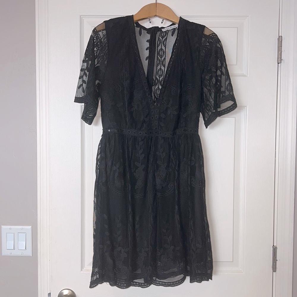 Small Bella Ella Light My Fire Black Dress stock photo included